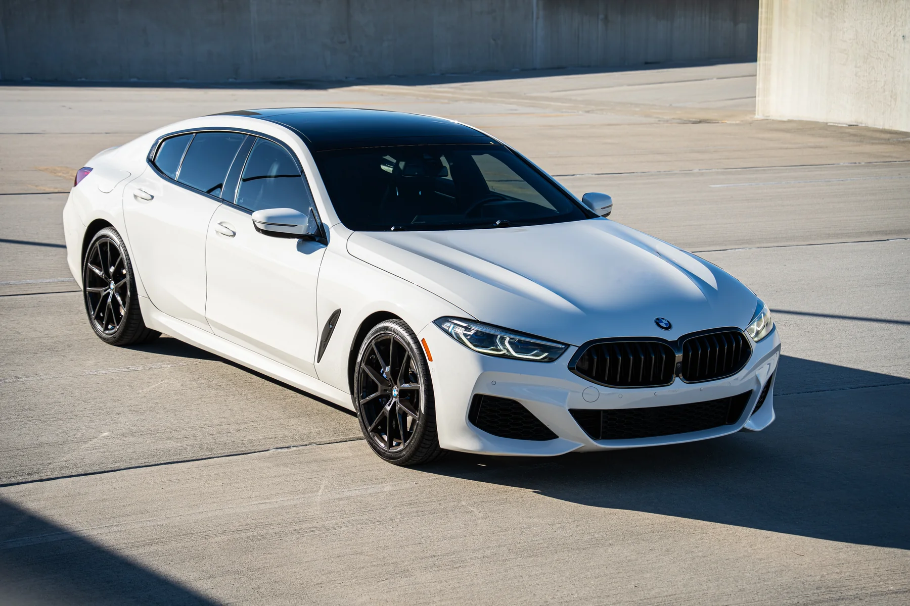 White BMW 840i Gran Coupe on an Atlanta rooftop