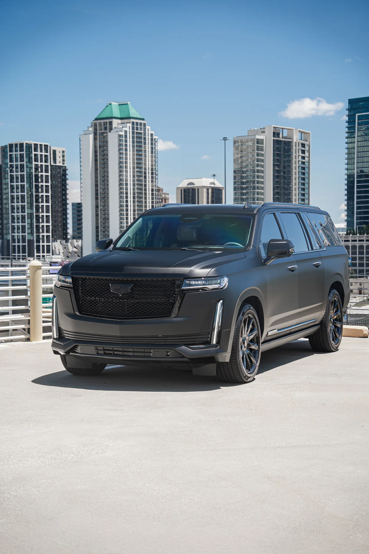 Matte black Cadillac Escalade on an Atlanta rooftop