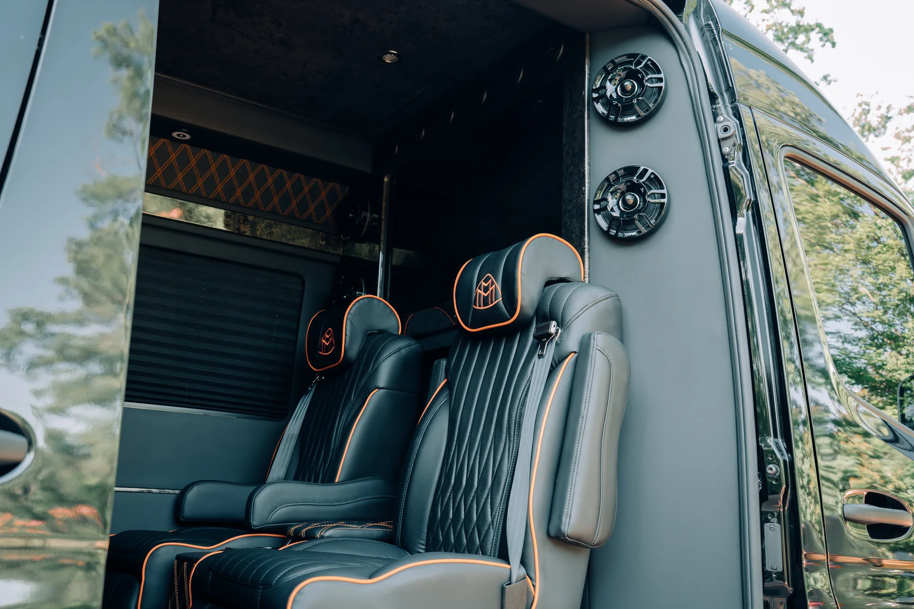 Mercedes-Benz Sprinter captain's chairs viewed through the passenger door