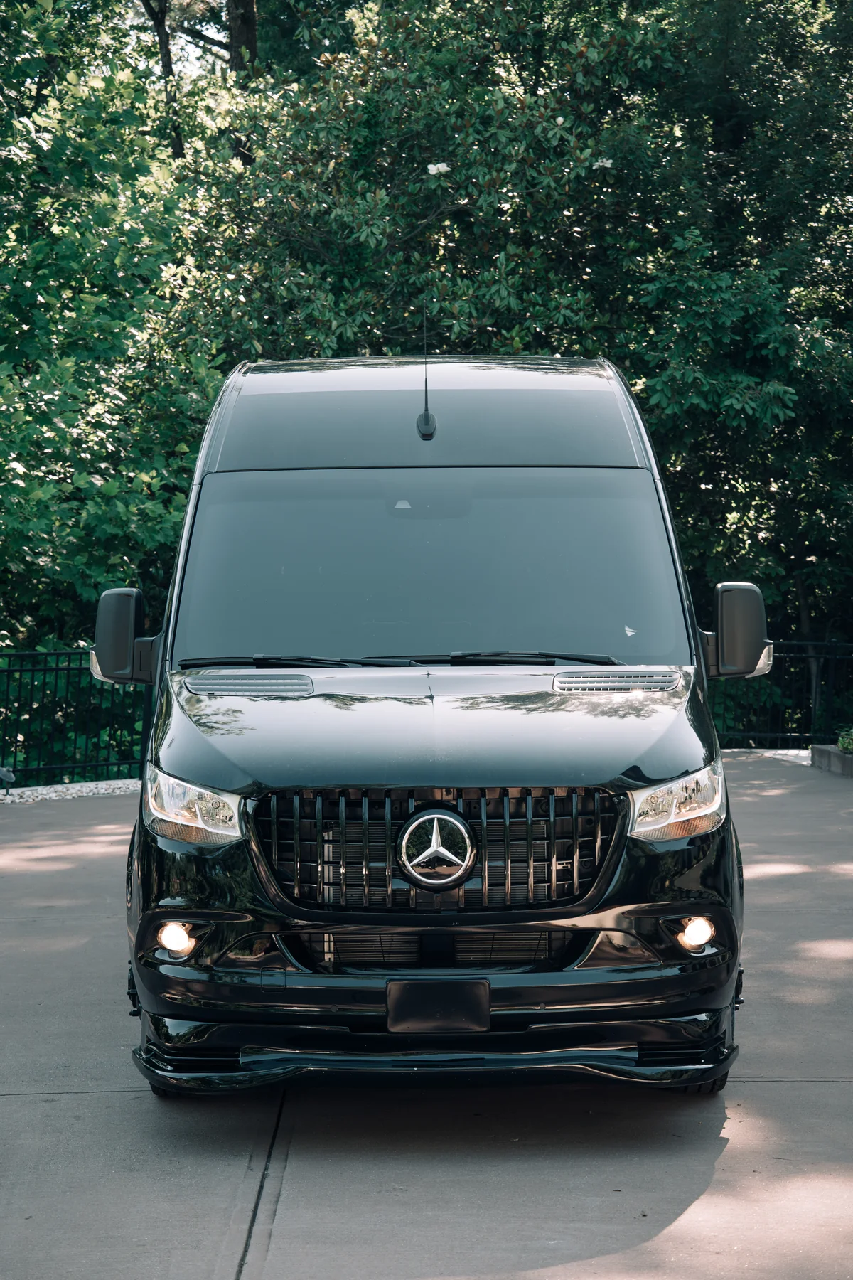 Front view of a black Mercedes-Benz Sprinter executive van