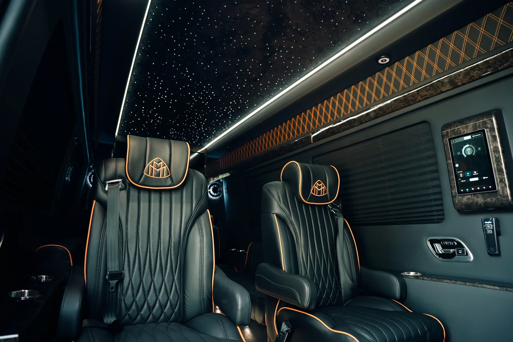 Mercedes-Benz Sprinter luxury cabin with captain's chairs and starlight ceiling